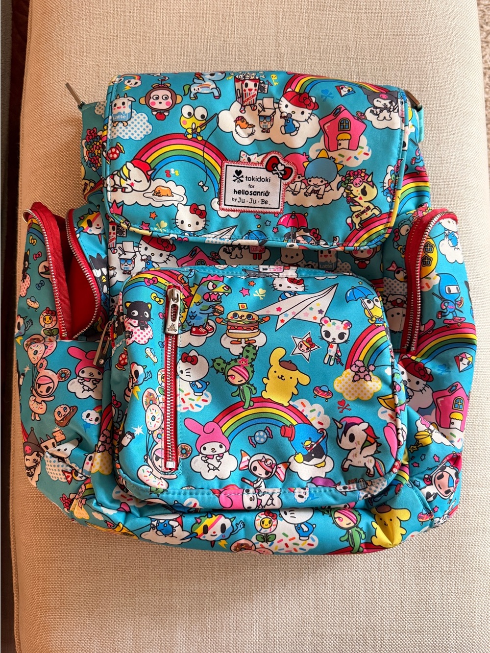 tokidoki x Hello Sanrio for JujuBe Baby Backpack - Bright Blue Rainbow Print